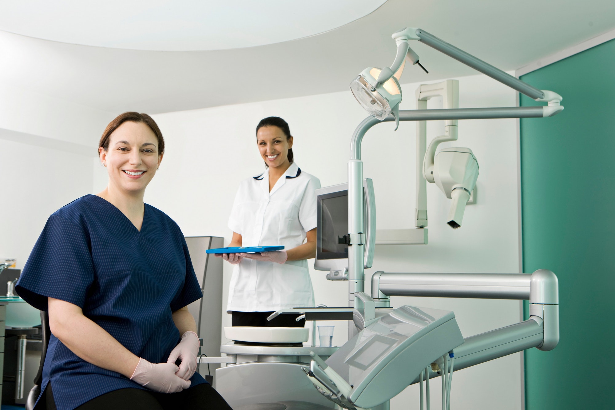 A female dentist and dental nurse