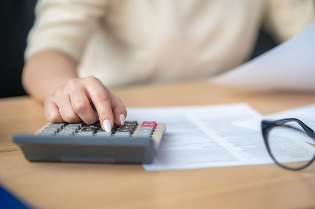 Bookkeeper calculating financial budget at the office desk