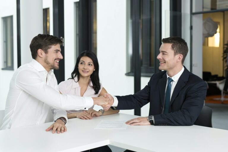 small business Consultant shaking hands with man