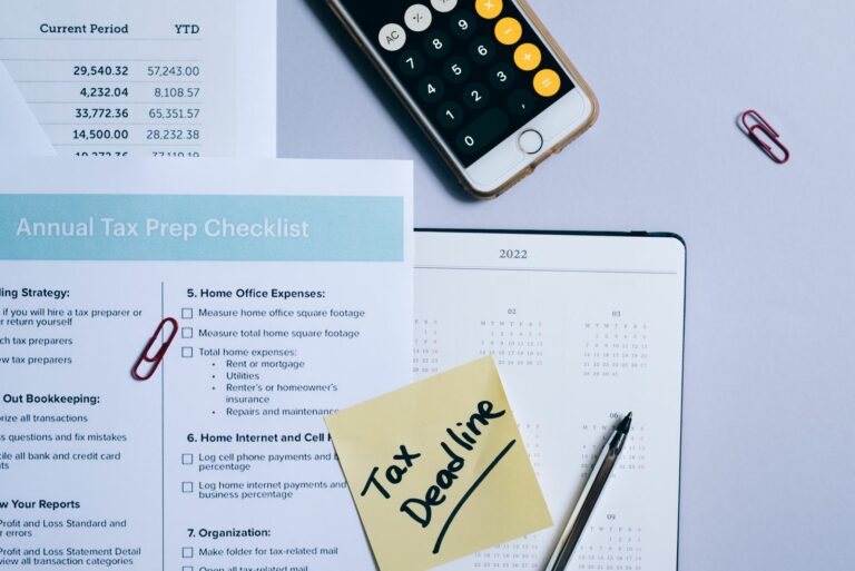 Tax planning checklist, calendar and calculator on a desk, illustrating year-end tax planning for dentists